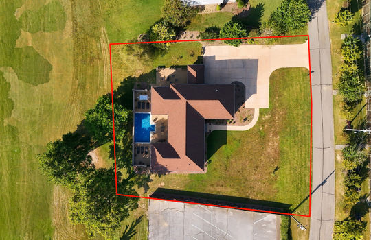 aerial view of home, overhead view, front yard, driveway, sidewalk, shingle roof, in ground pool, property outline