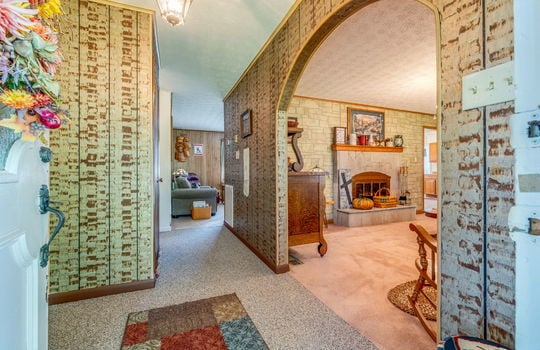 foyer, entryway, paneling walls, carpet