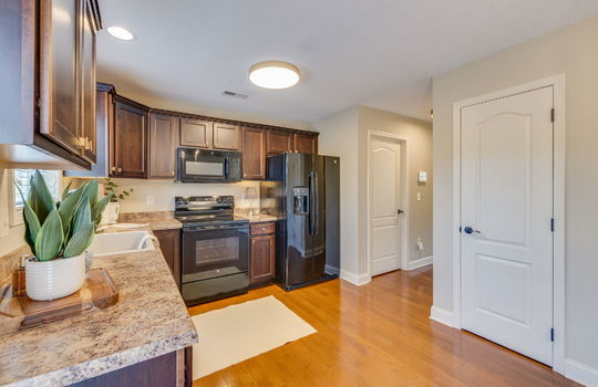 kitchen, hardwood flooring, countertops, cabinets, sink, refrigerator, oven/range, built-in microwave