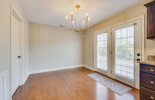 dining area, hardwood flooring, double door to balcony