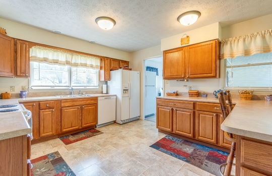 kitchen, cabinets, countertops, sink, refrigerator, dishwasher, oven/range, laminate flooring,