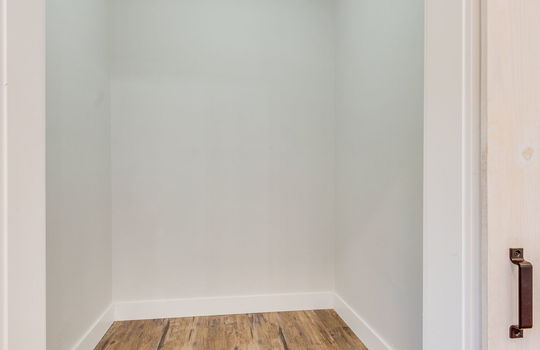 pantry/storage room, luxury vinyl flooring, barn door