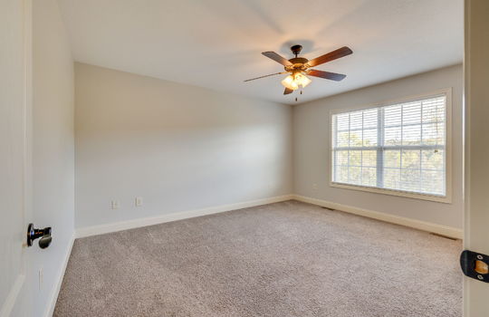 second bedroom, carpet, ceiling fan, windows