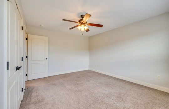 second bedroom, ceiling fan, carpet, closet