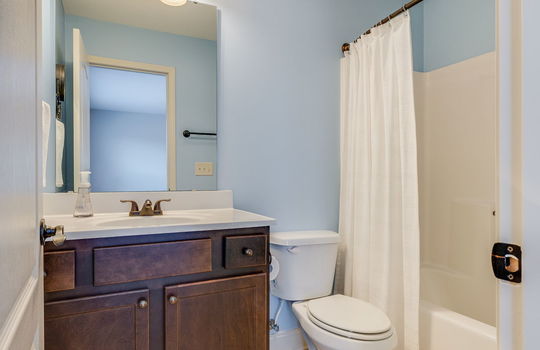 second bedroom ensuite bathroom, sink, toilet, shower/tub