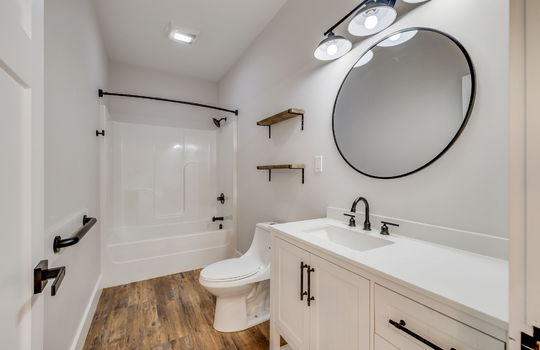 second bathroom, sink, toilet, shower/tub, luxury vinyl flooring