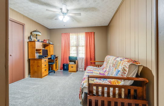 bedroom, carpet, painted paneling walls, closet, ceiling fan, windows