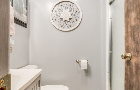 bathroom, tile flooring, sink, toilet, shower, glass shower door