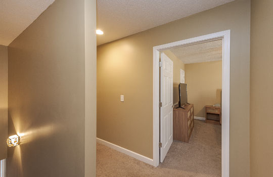 upstairs landing, carpet, view toward hallway and into bedroom