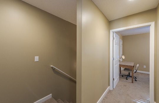 upstairs landing, view into bedroom, carpet