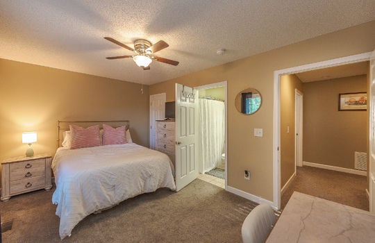 bedroom, ensuite bathroom, carpet, tile flooring, ceiling fan