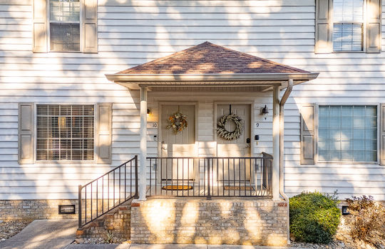 townhouse, covered front porch, neighboring townhouse, front door, vinyl siding