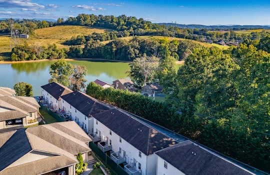 aerial view of townhomes, Boone Lake, neighboring properties, trees, mountain views
