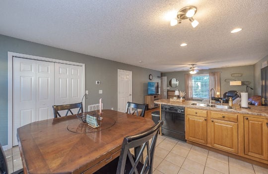 kitchen, eat-in kitchen, dishwasher, sink, cabinets, countertops, view toward living room