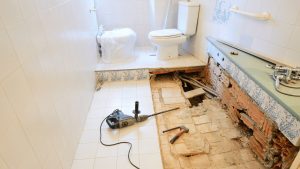 bathroom remodeling with a tool on the floor