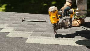 a man with a tool fixing roof