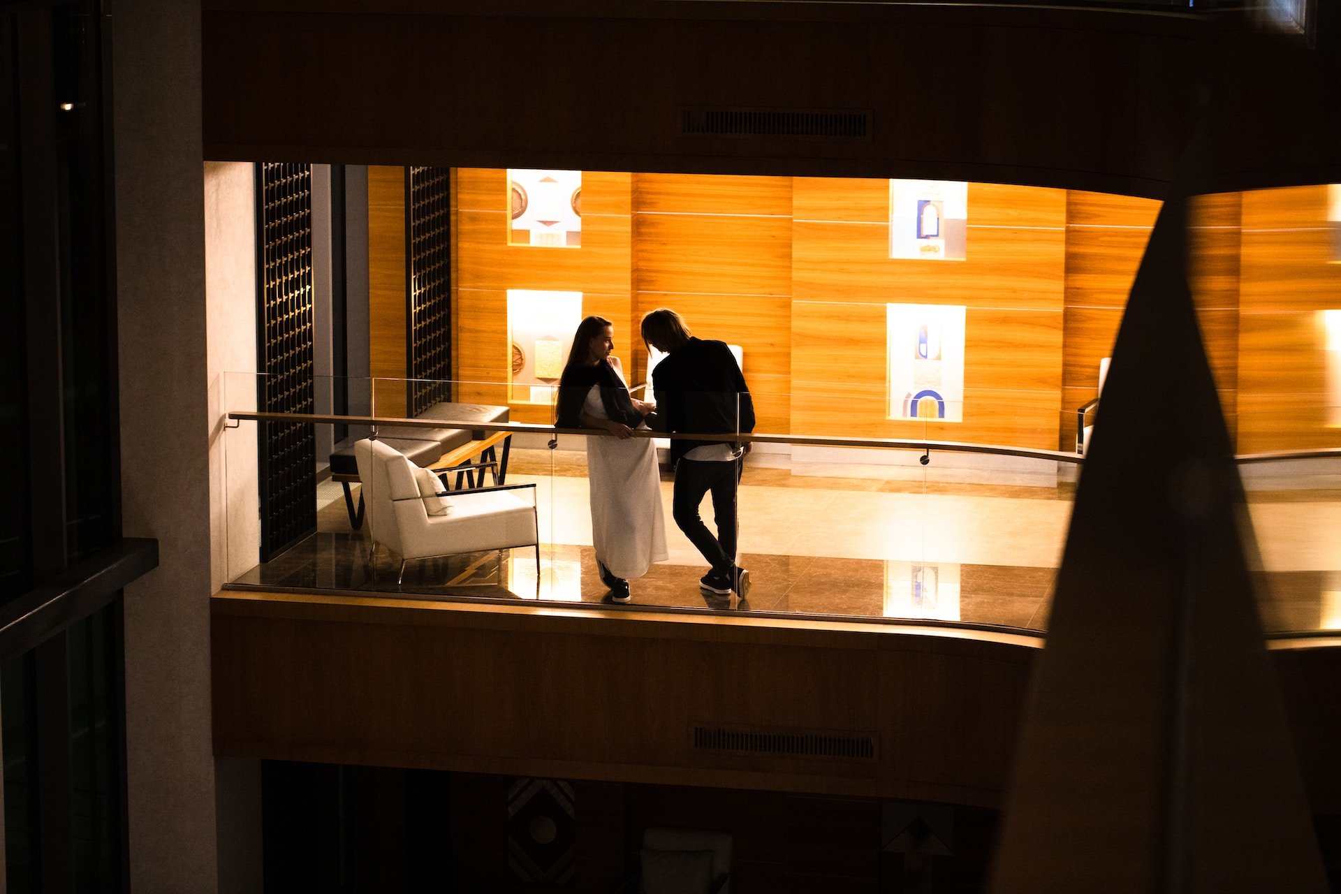 Couple is standing in a hotel balcony