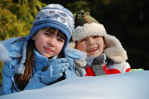 Two kids playing in snow