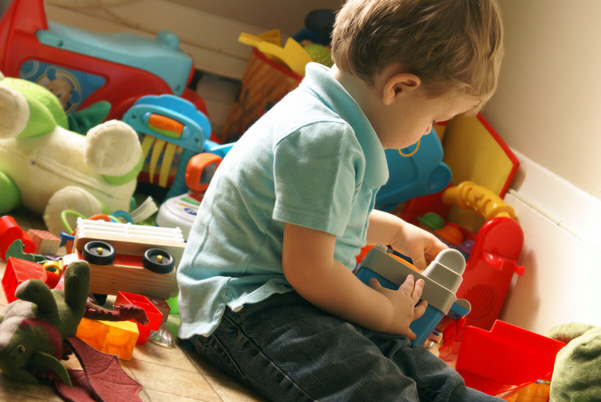 A boy playing with toys