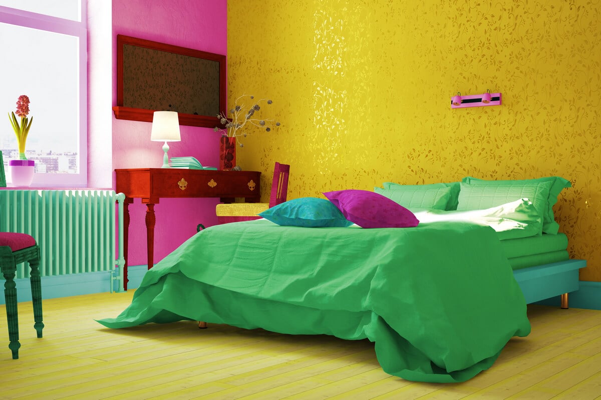 Green bed in a yellow room