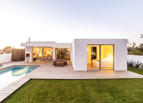 Modern house with garden swimming pool and wooden deck
