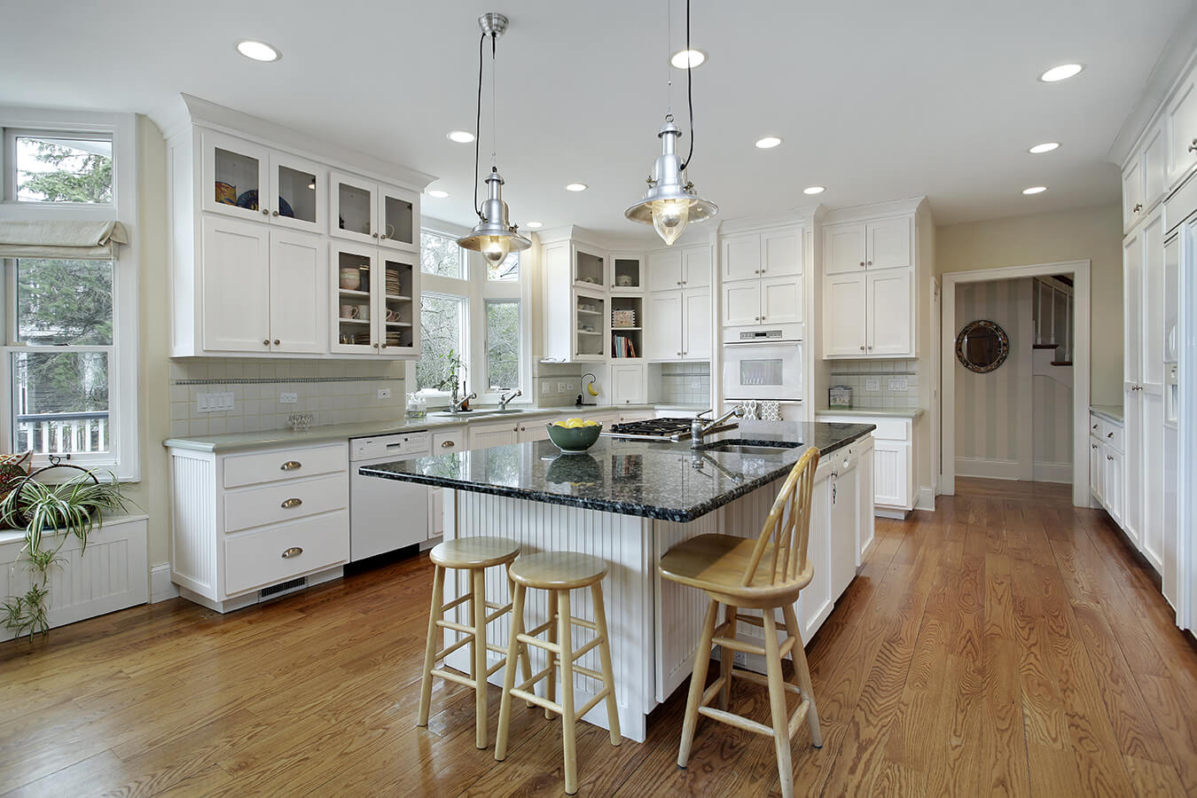 Kitchen-in-luxury-home-with-large-granite-island