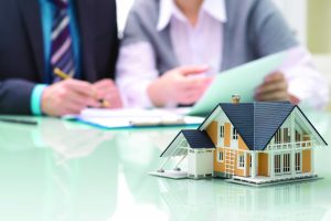 Businessman,Signs,Contract,Behind,Home,Architectural,Model