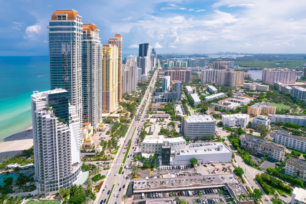 Sunny-Isles-Beach-Florida.-Panorama-of-Miami-Beach-FL.-Atlantic-Ocean-beach.-Beautiful-seascape.-Turquoise-color-of-sea-water.-Summer-vacation-in-Florida.-Aerial-view-on-Hotels-and-Resorts-on-Island