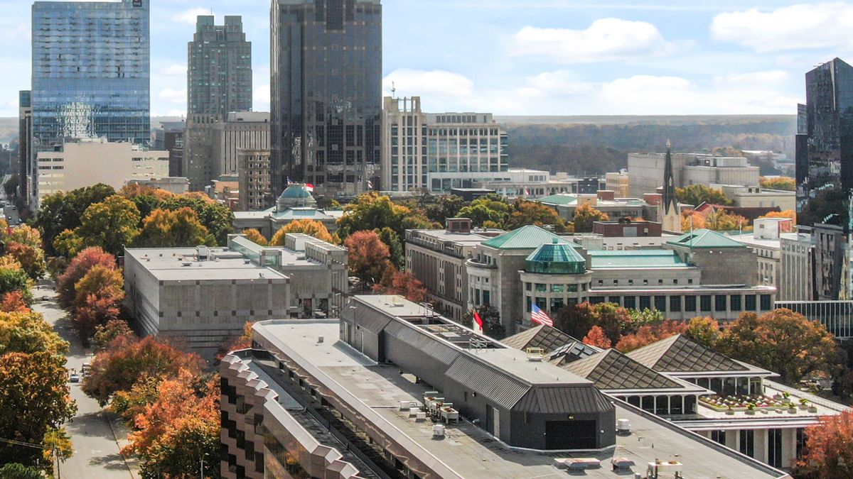 Downtown Raleigh, NC office towers above orange and red fall trees