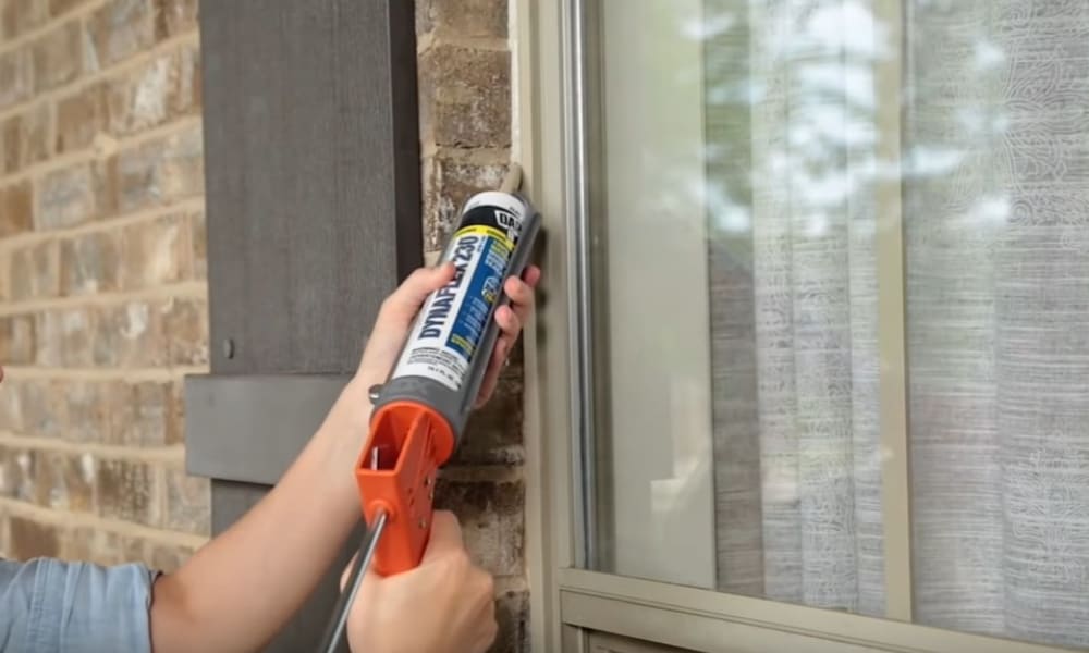Apply caulking to the window to seal for winter