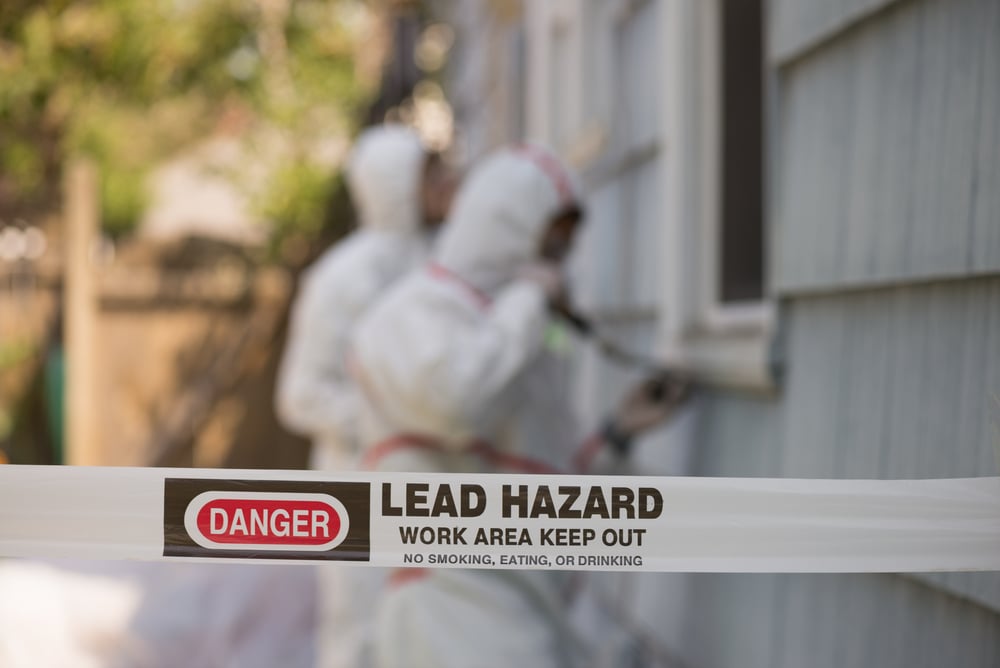 Two,House,Painters,In,Hazmat,Suits,Removing,Lead,Paint,From