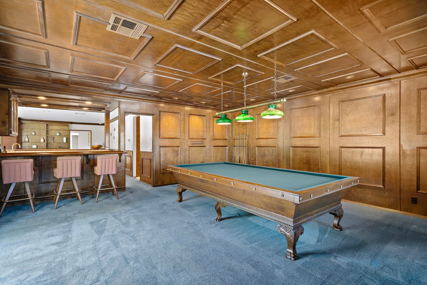 Wood paneled game room at a Brea estate sold by Aragone & Associates