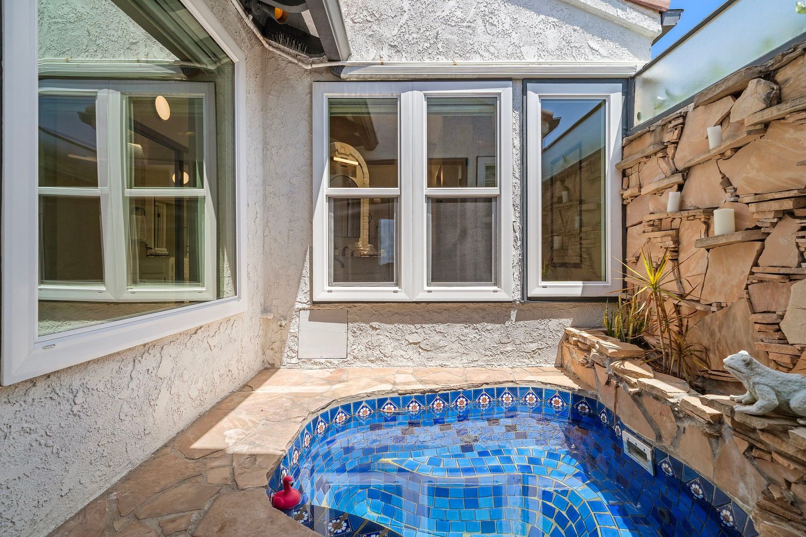 Private in-ground spa beyond the primary suite at 306 Via Colibri