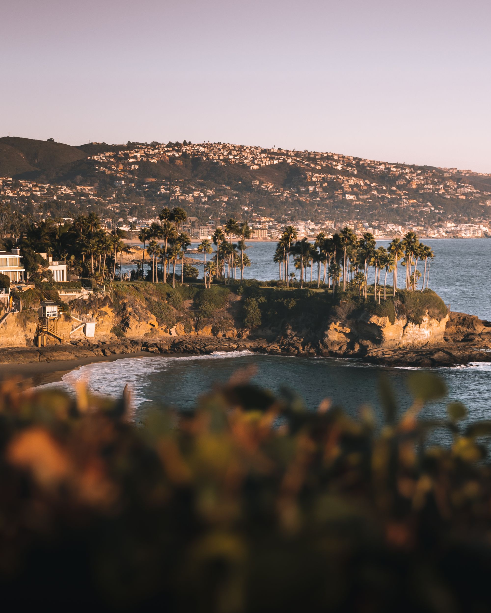 Coastal cliffs above the ocean at sunset