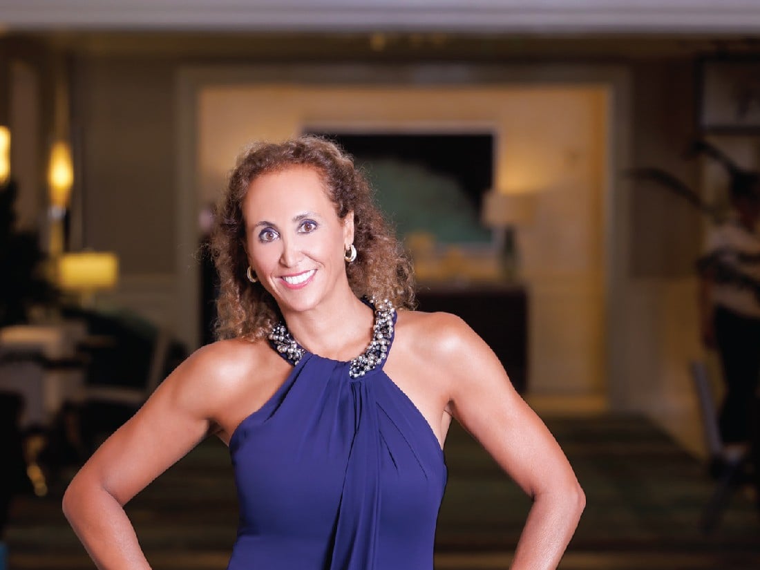 Paula Aragone in a blue dress, featured in Riviera Dynamic Women by Modern Luxury