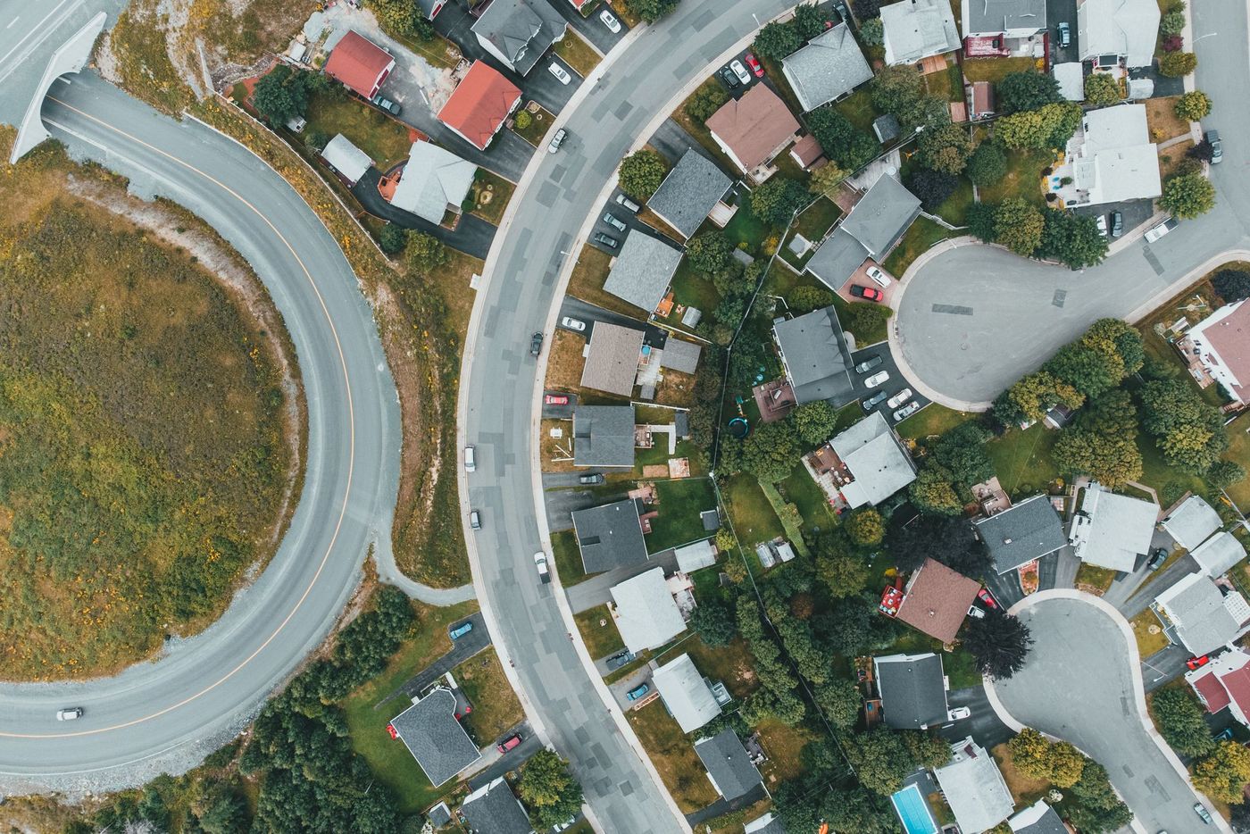 Aerial view of an Orange County neighborhood with curved residential streets
