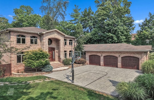 57 - Front 3 Car Garage and BasketBall