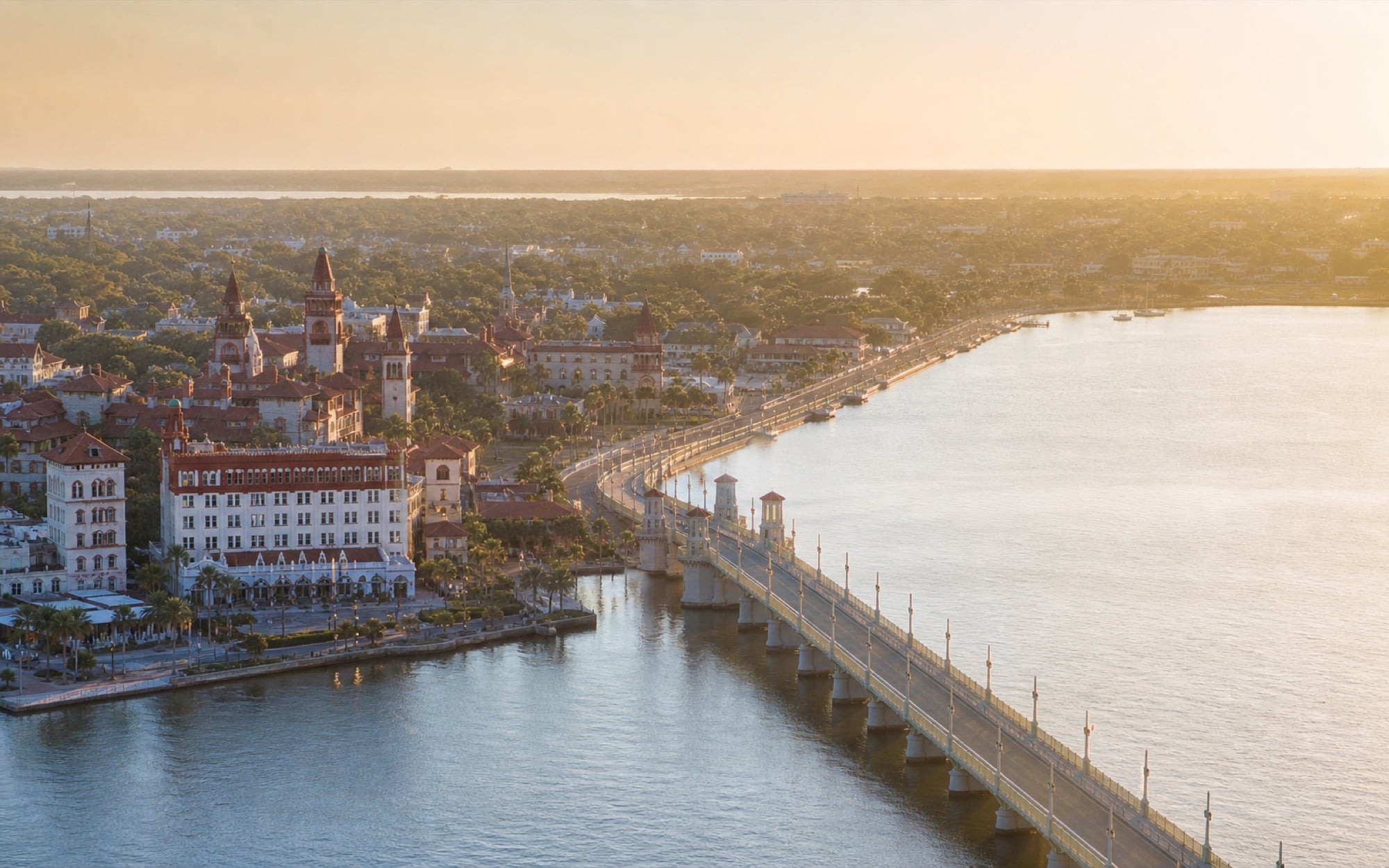 Aerial view of the St. Augustine waterfront and Bridge of Lions at golden hour