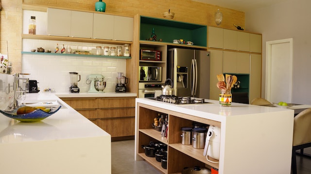 kitchen with light wood cupboards and white counters