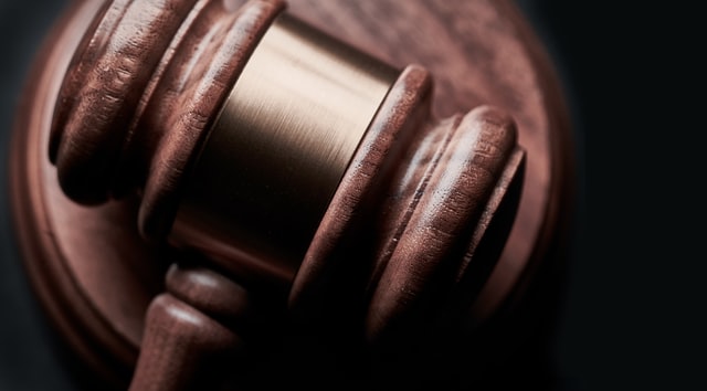 a brown and gold judge's gavel