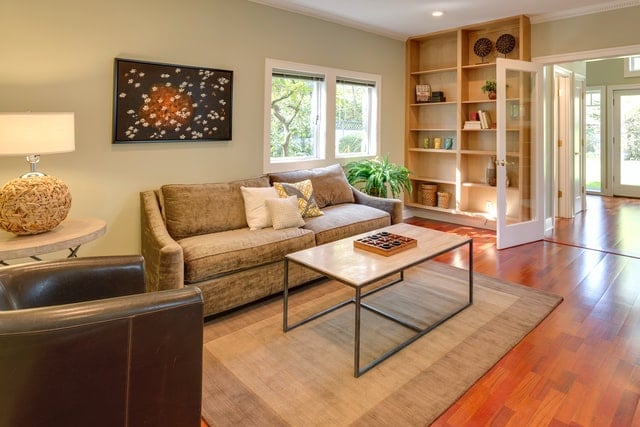 a living room with a couch and armchair