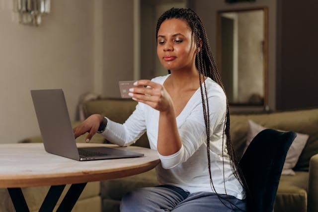 a person making an online payment with a credit card