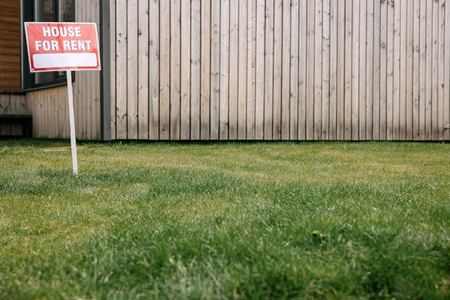 a for rent sign in a front yard