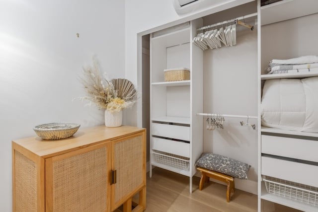 a large closet with a built in storage unit