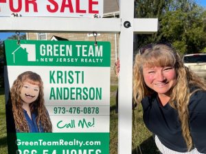 Kristi Anderson with GTNJR For Sale Sign