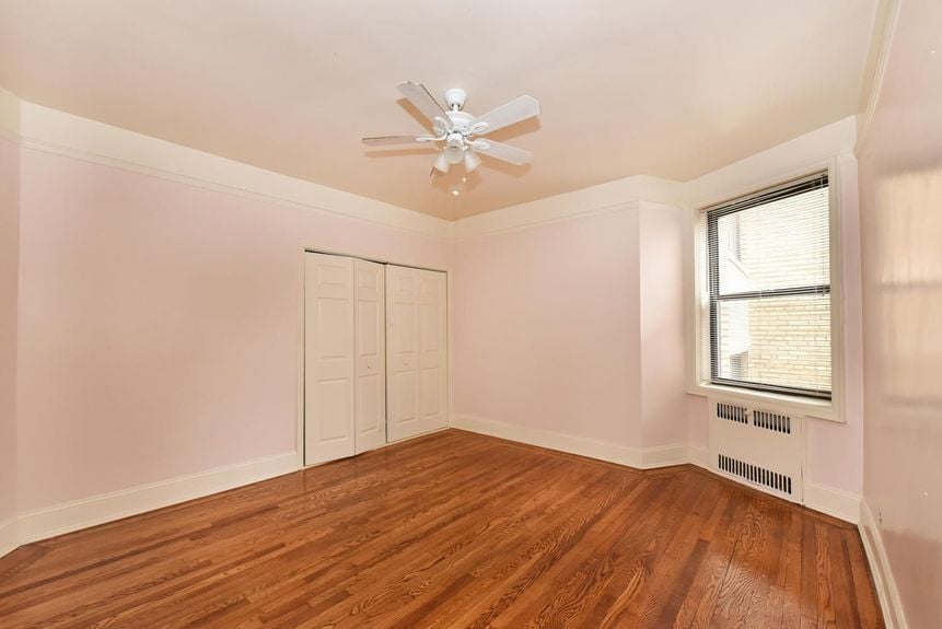 Empty bedroom with fandelier