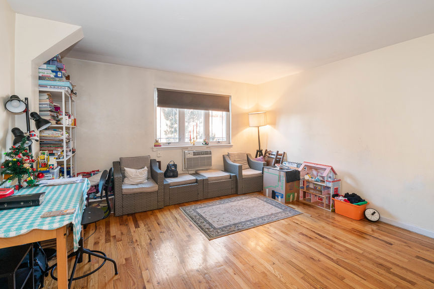 Living room with sofa set on a furnished wooden floor