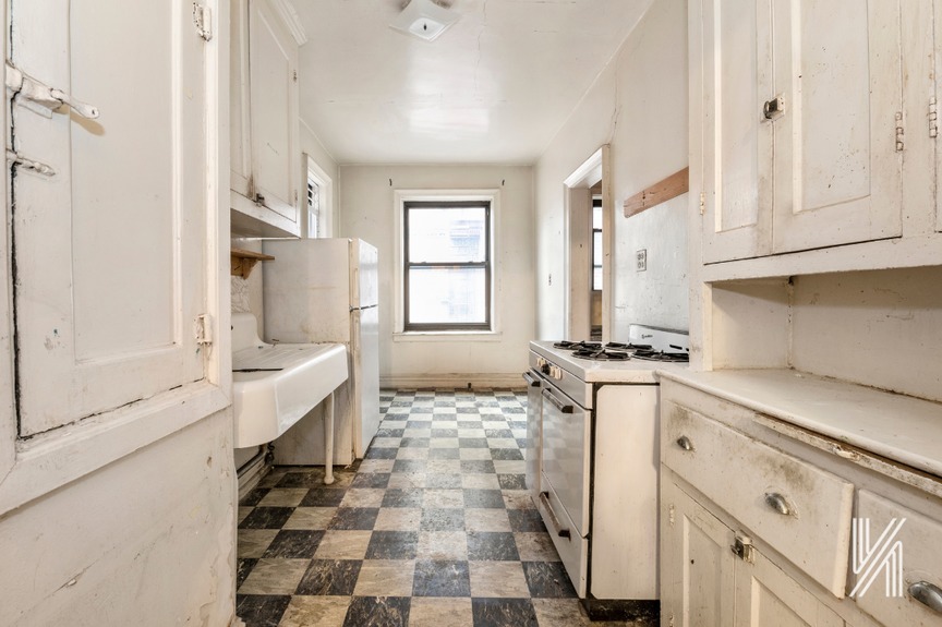 Kitchen with black and white tiled floor