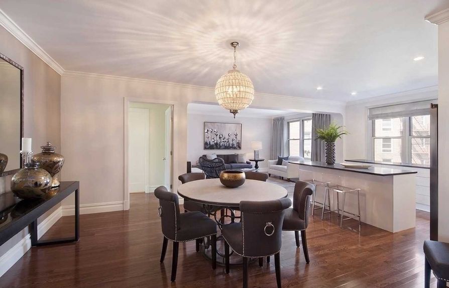 Room with dining table and chandelier