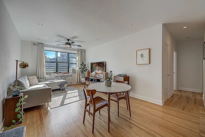 Living room and dining area with table and chairs